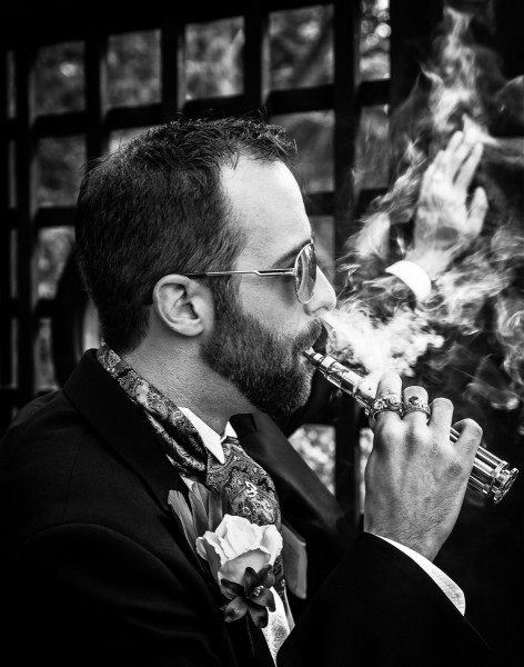 Fine art picture of Groom with vape and smoke