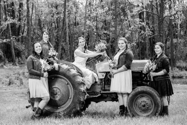country wedding bride and bridesmaid on tractor